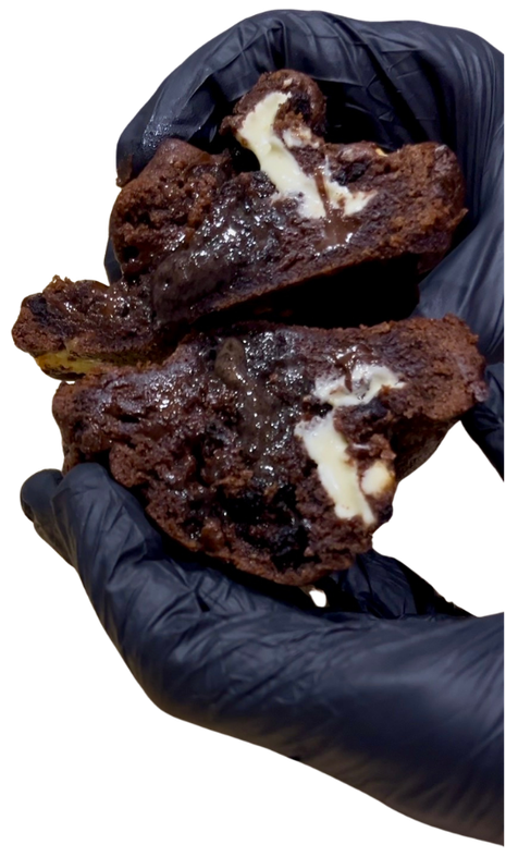 Triple Chonkolate held in a black-gloved hand